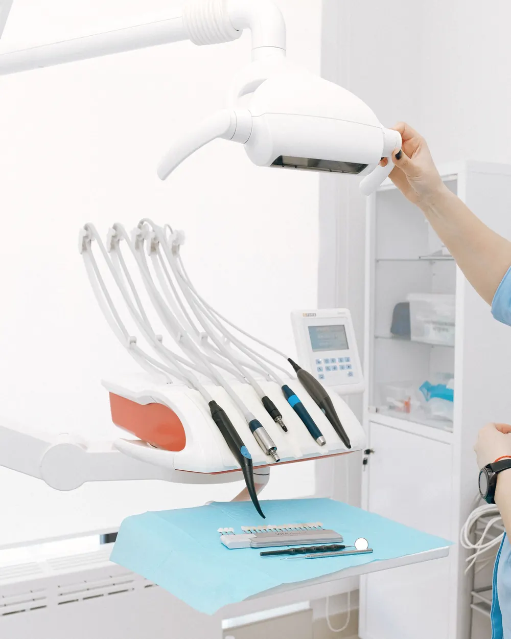 A bright, clean treatment room with a dental chair